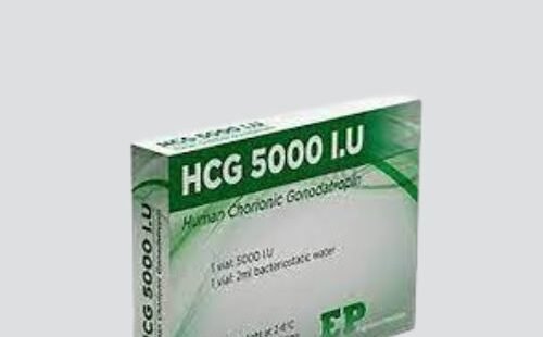 Photograph of an IVF medication vial labeled 'hCG 5000IU Injection'.