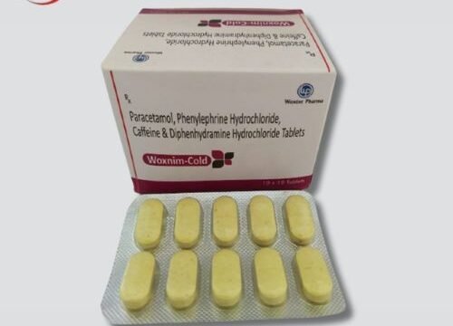 Woxnim Cold Tablet: A blister pack of cold relief medication against a blue background