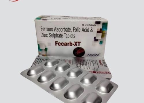 Image: Fecarb-XT Tablet - a white pill with blue coating, displaying brand logo and dosage information.